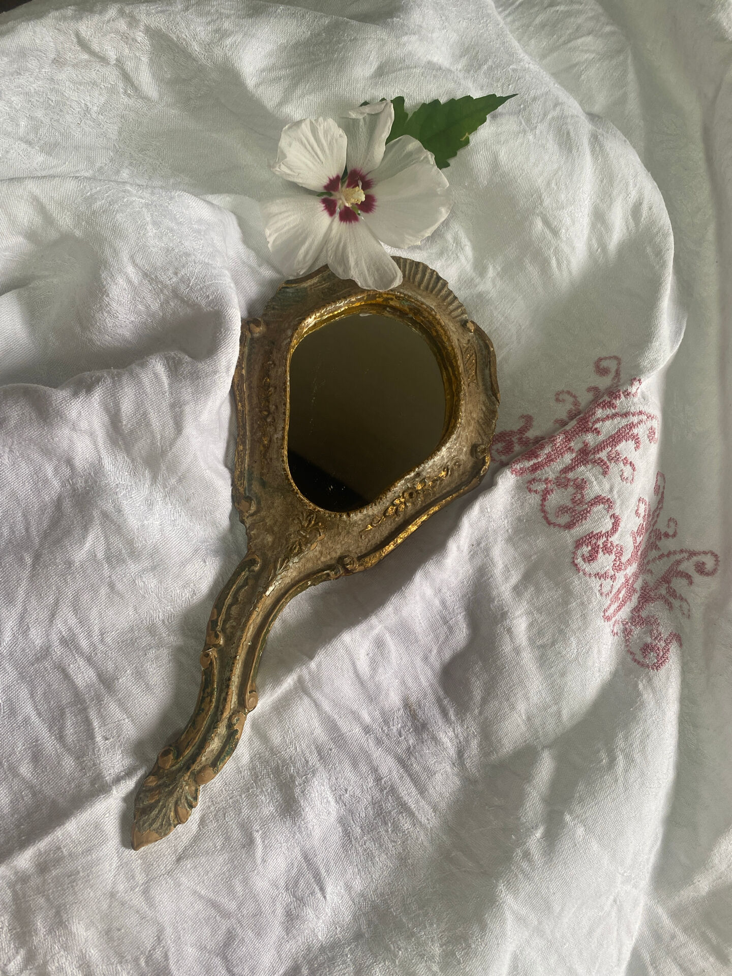 Patinated wooden Florentine hand mirror