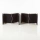 Modern black leather lounge chairs with an aluminium frame.