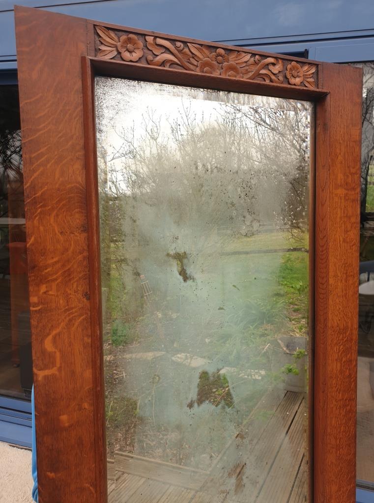 Art Deco door mirror with floral pattern frame