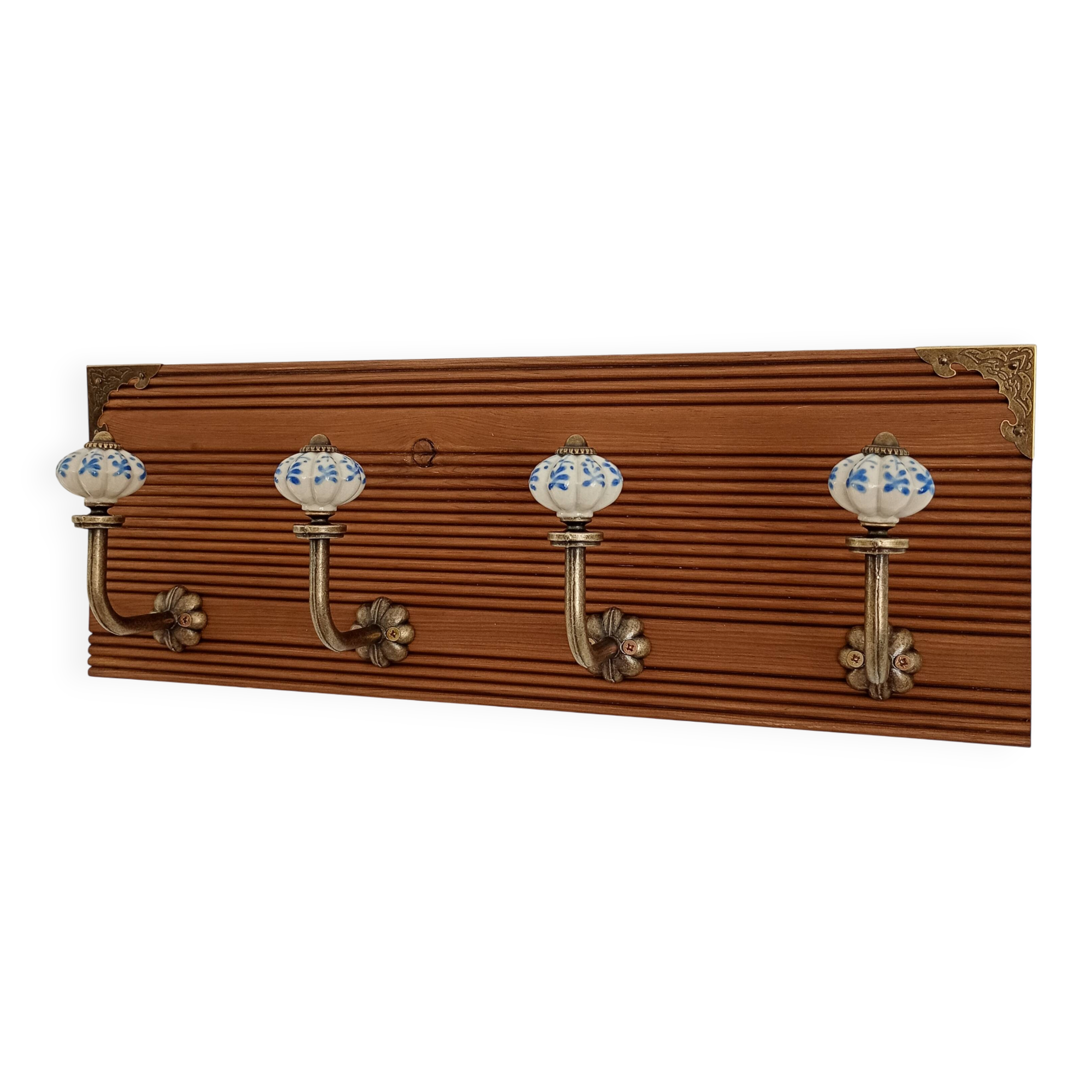 Wall-mounted coat rack with 4 ceramic hooks in blue and white, vintage style.