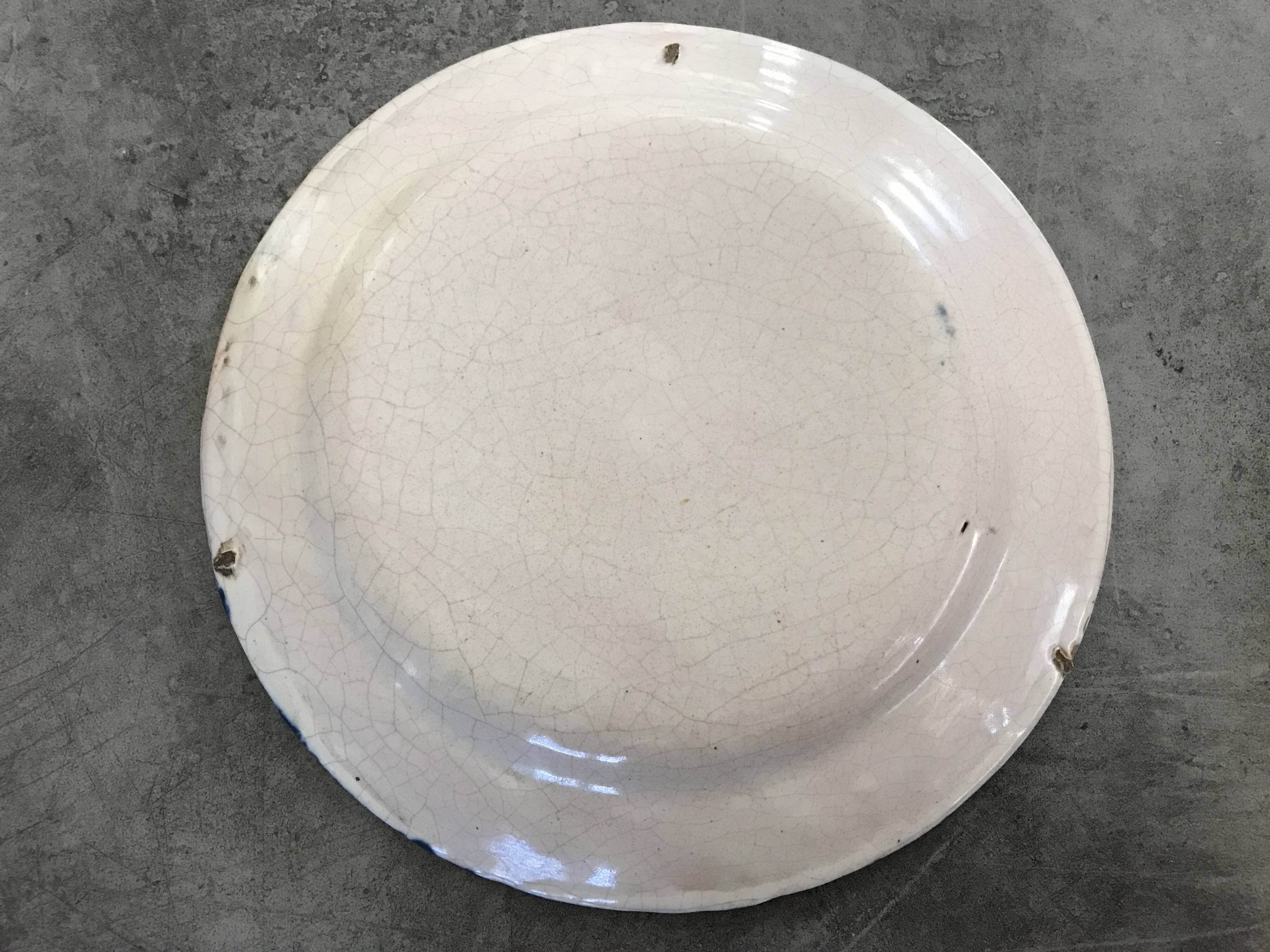 Old plate in auvillar earthenware, floral painting decoration, 19th century