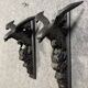 Rare pair of patinated wooden wall consoles, featuring two eagles with outstretched wings.