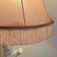 Ceramic lamp with birds, pink fringed shade, 1950s.