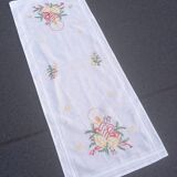 Embroidered tablecloth and table runner