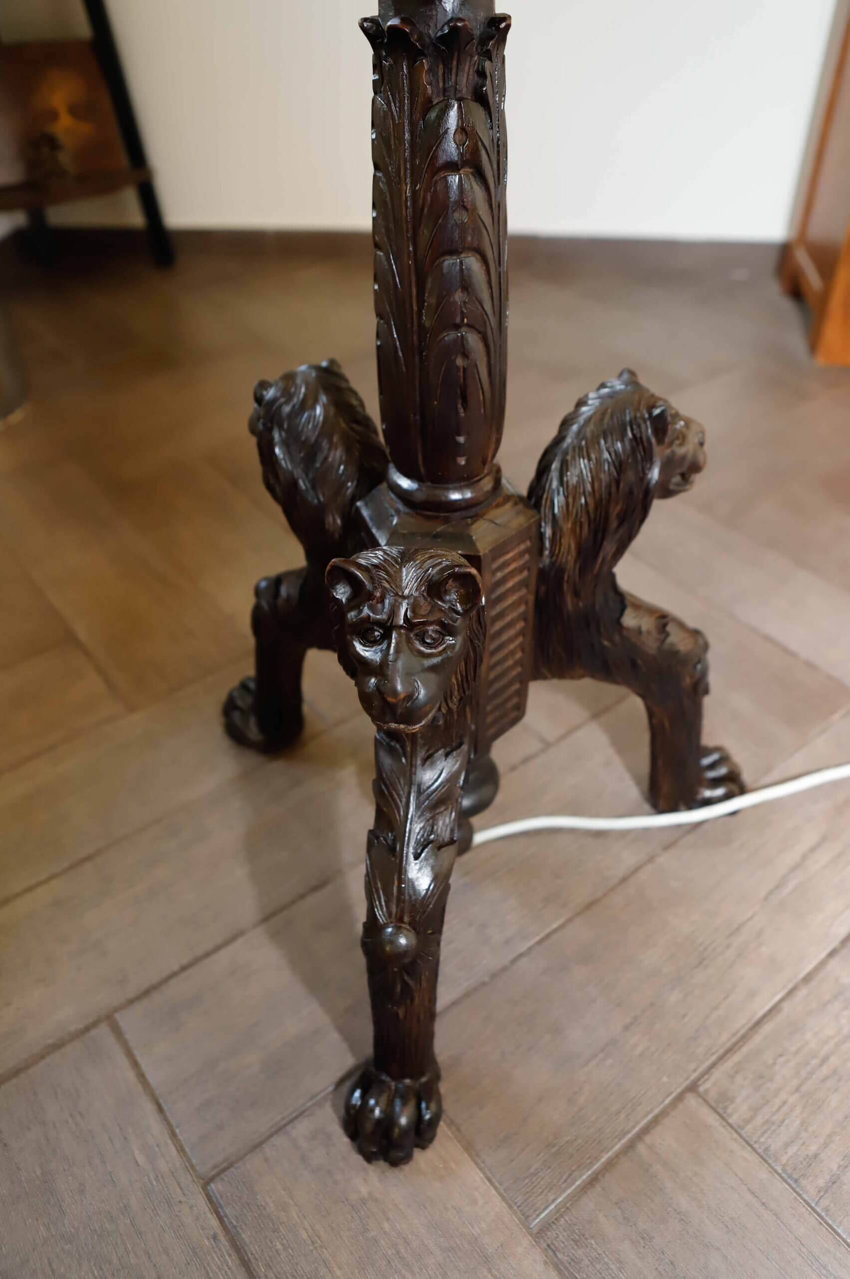 Antique floor lamp with lion motif
