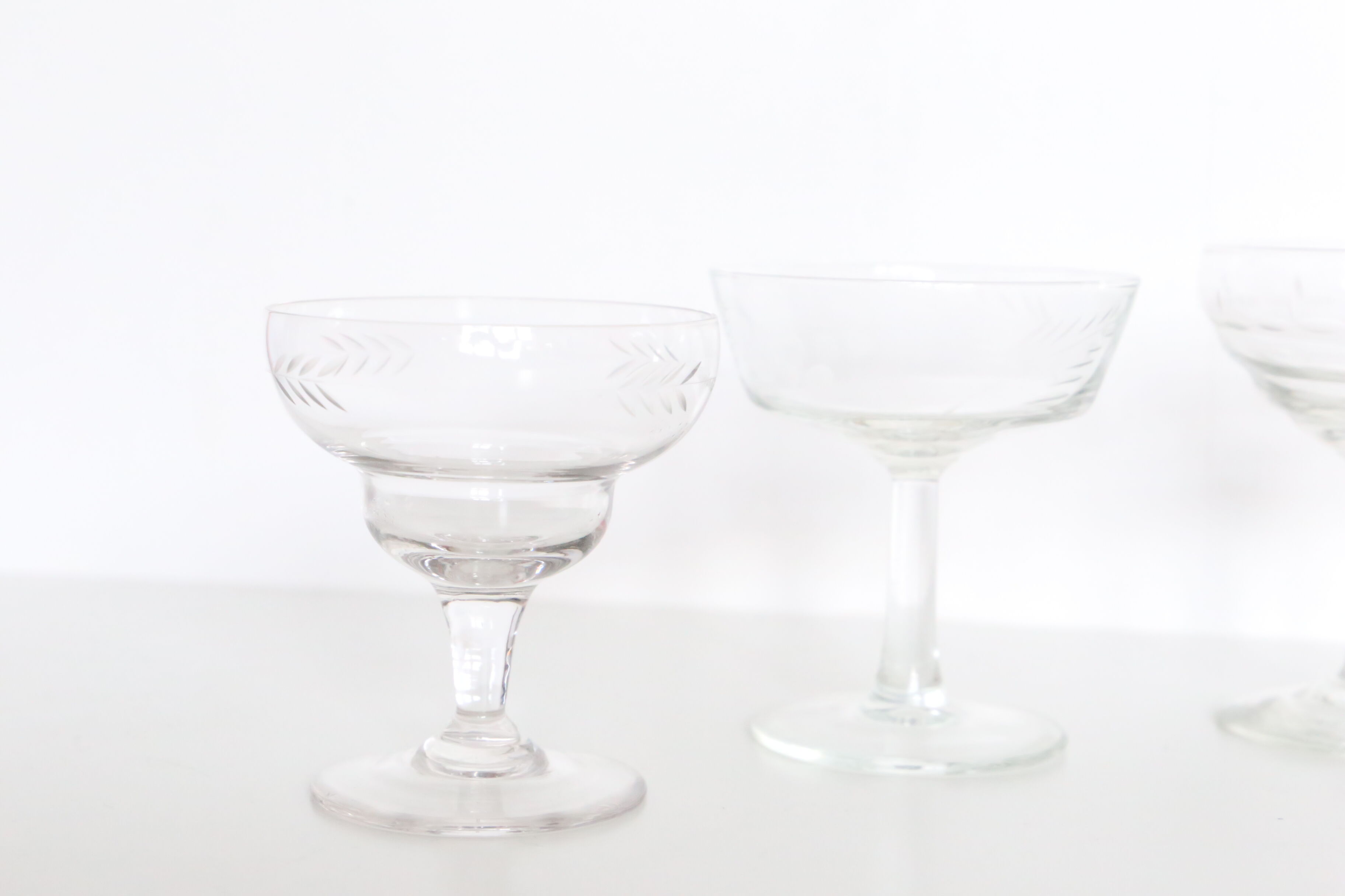 Set of 6 mismatched champagne glasses, chiseled glass