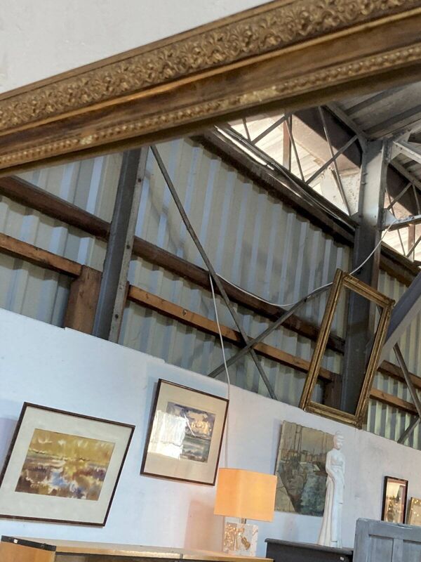Miroir de cheminée - bois vernis et stuc doré à décor de palmettes