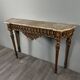 Louis XVI style console in carved wood with a gilded patina, 19th century.