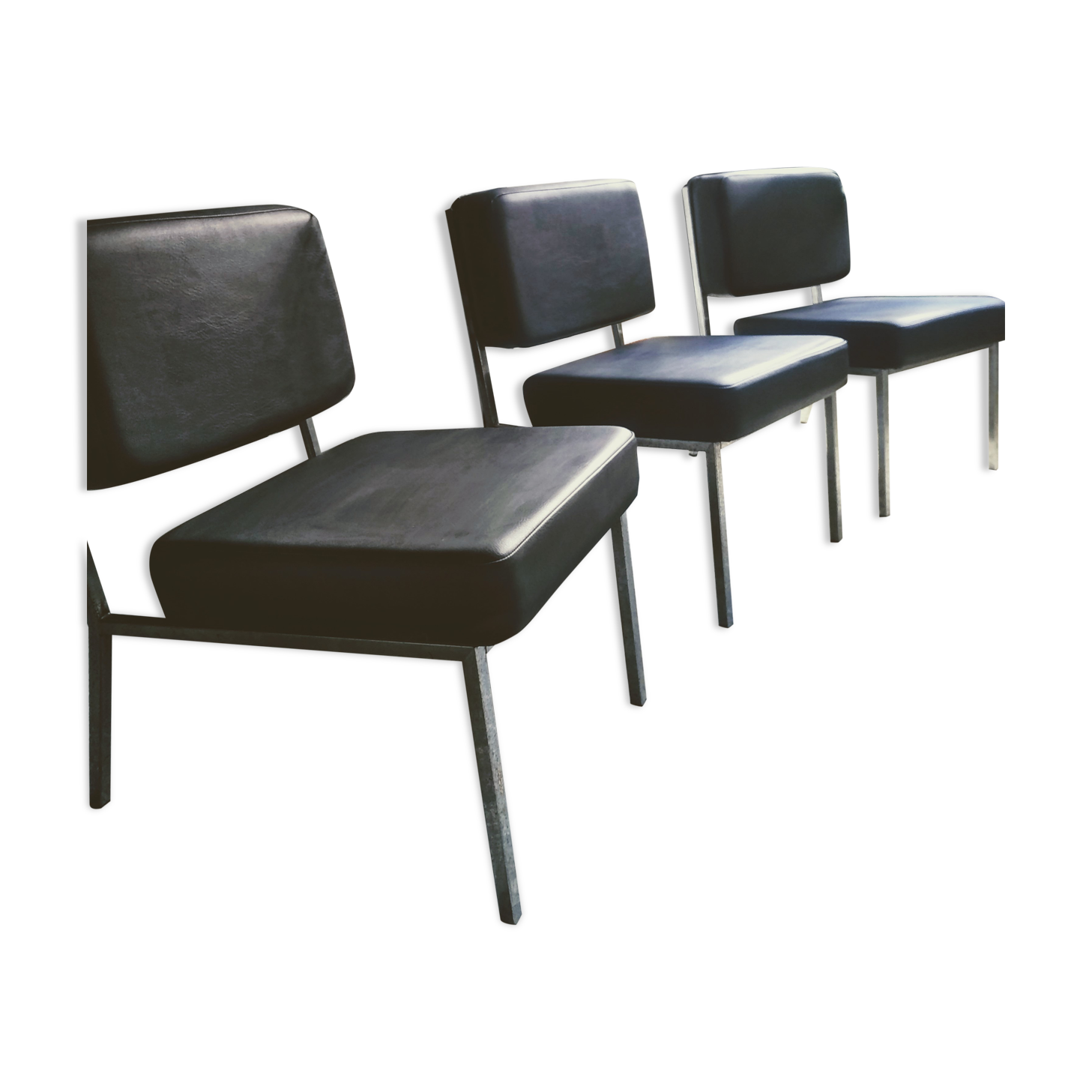 3 black armchairs