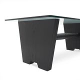 Coffee table with a glass top and black stained wood frame, 1930s.