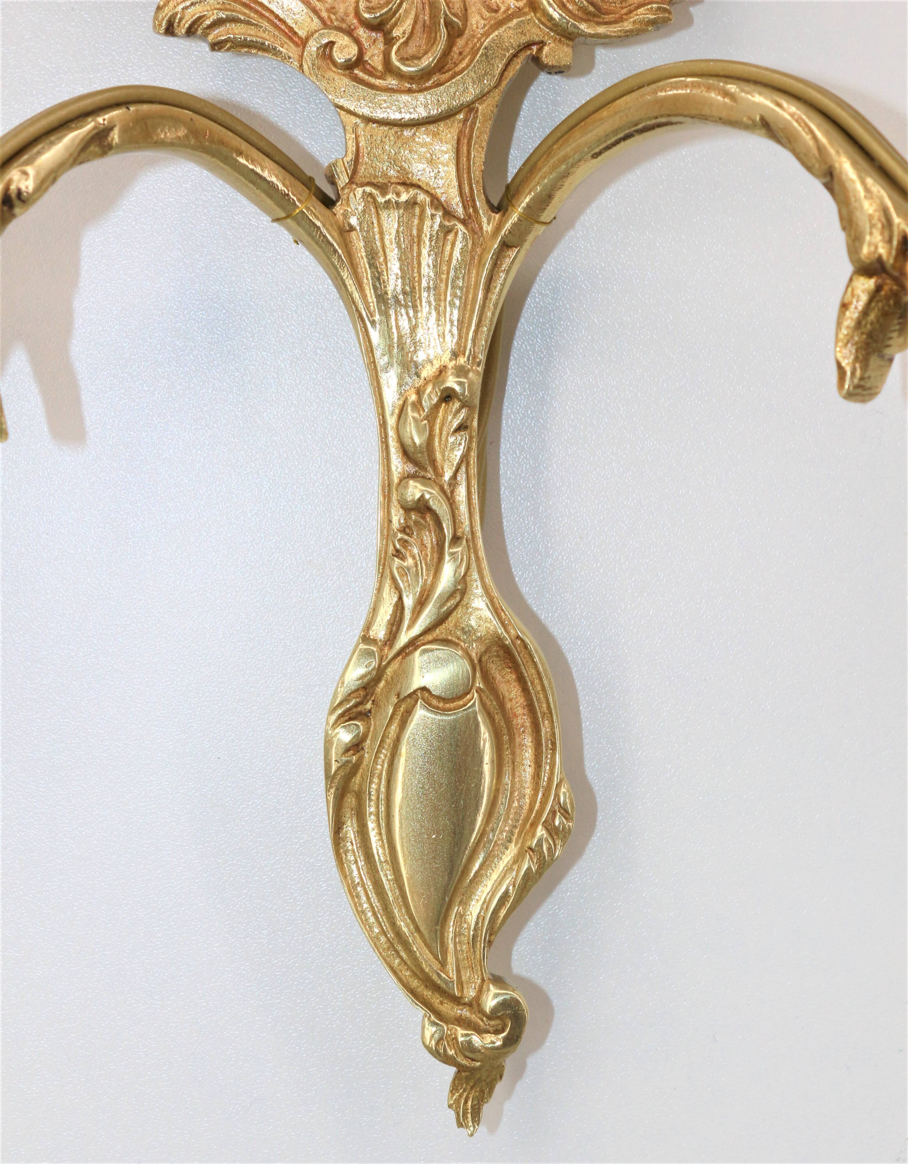 Pair of Louis XV style beveled mirror sconces in bronze by Lucien Gau