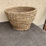 Brown woven wicker basket for collecting eggs — France, 1940s