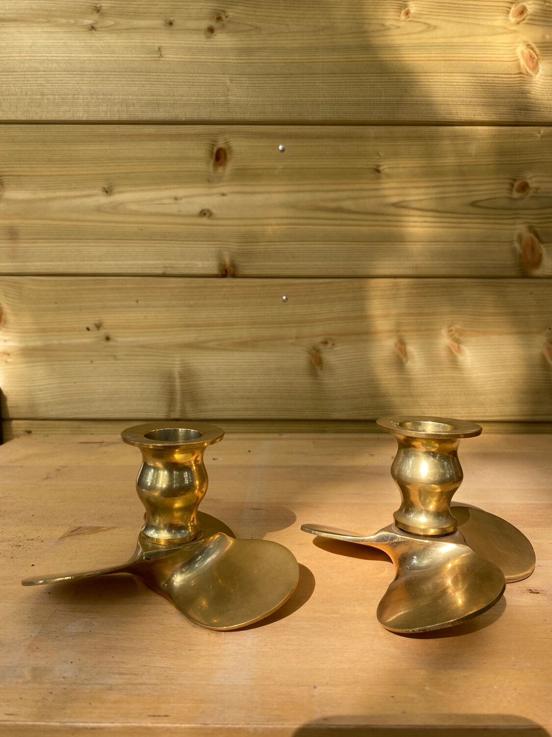 Pair of brass candle holders, helix shape