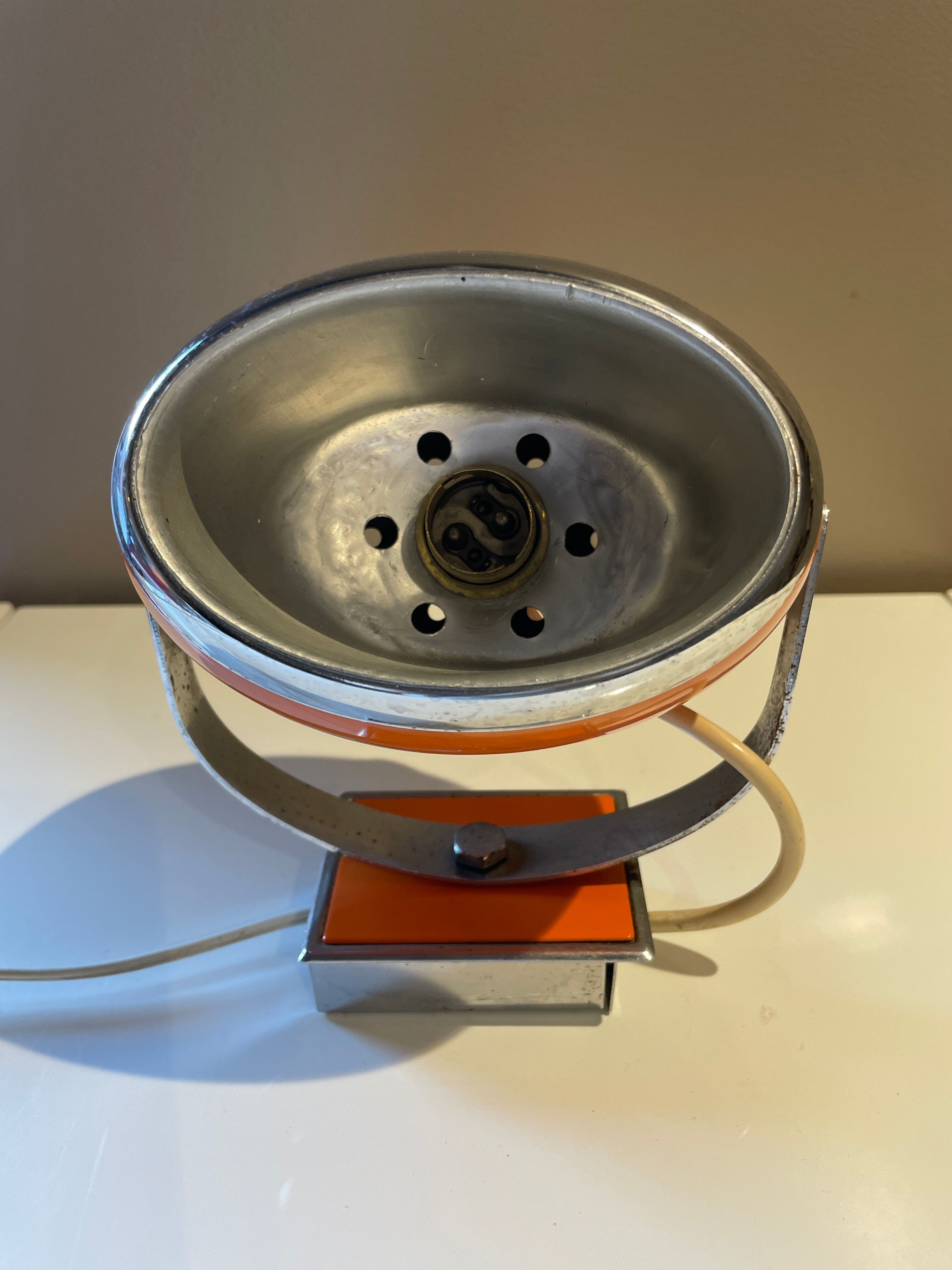 Orange eye ball wall lamp