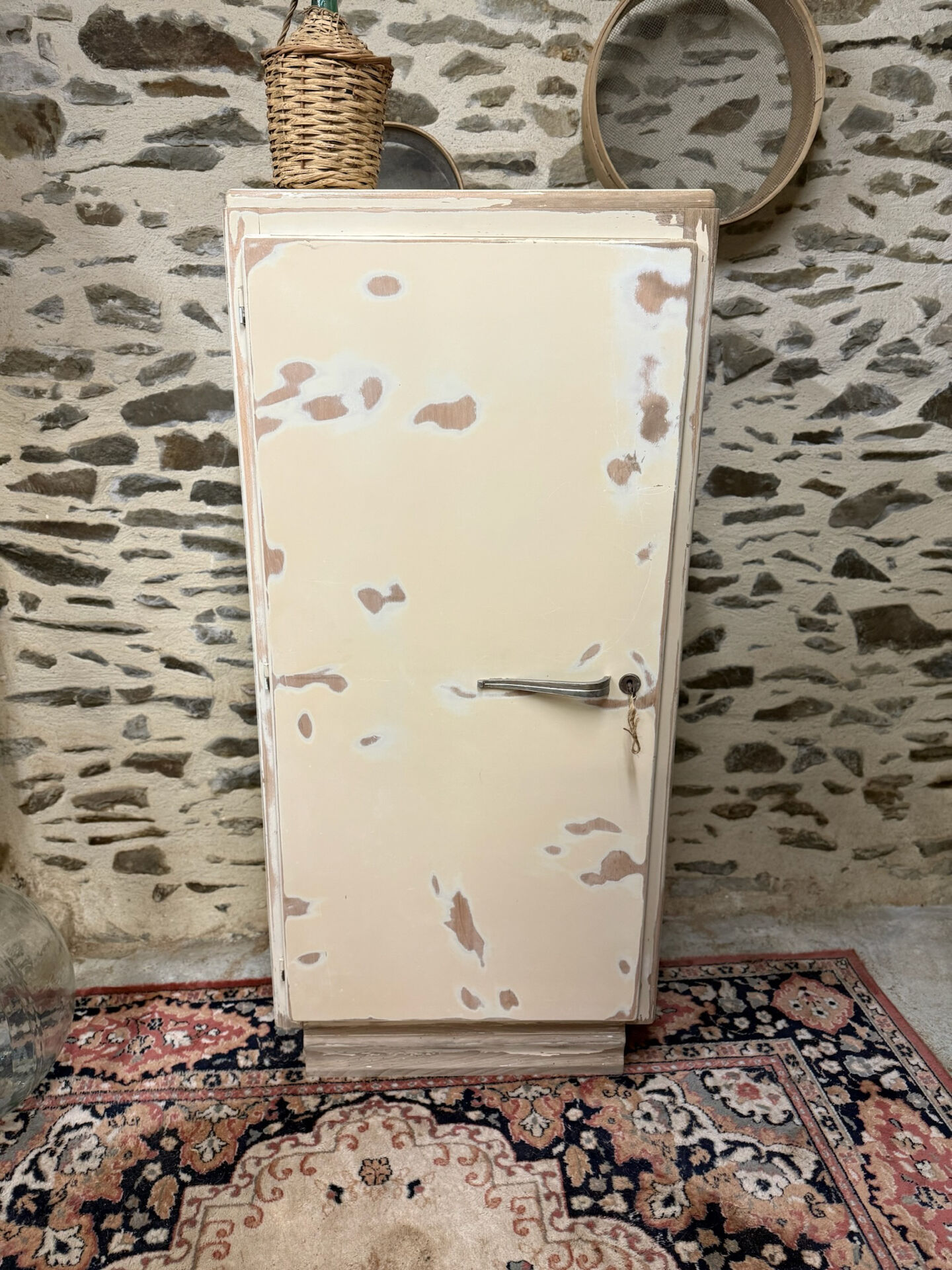 Small one-door Art Deco cabinet with a patina.