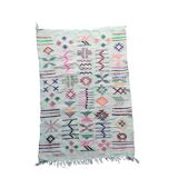 White Moroccan rug with Berber patterns.