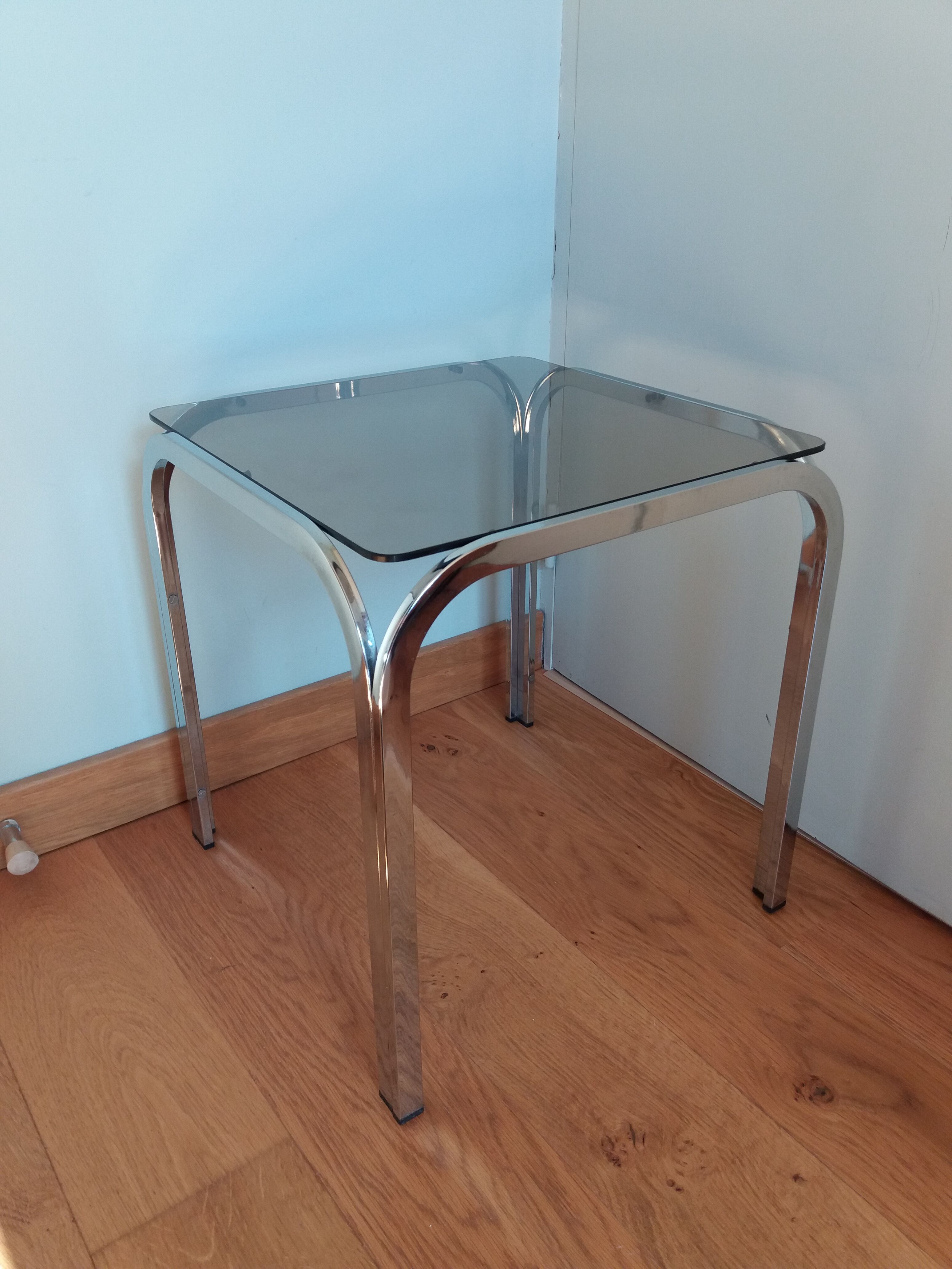 Square coffee table in chromed metal and smoked glass