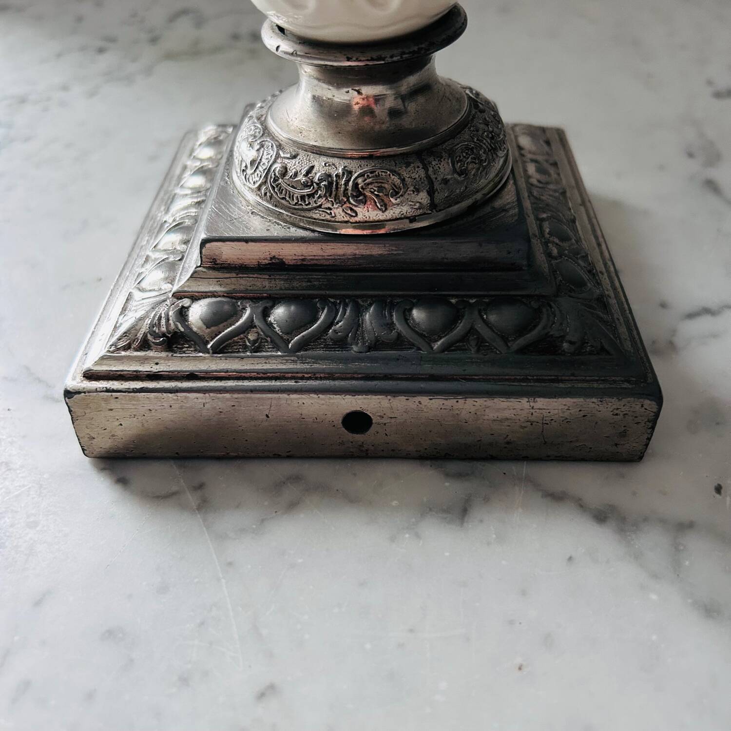 Silver-plated metal and porcelain candlestick