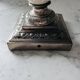 Silver-plated metal and porcelain candlestick
