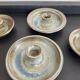 Series of 4 vintage stoneware candle holders