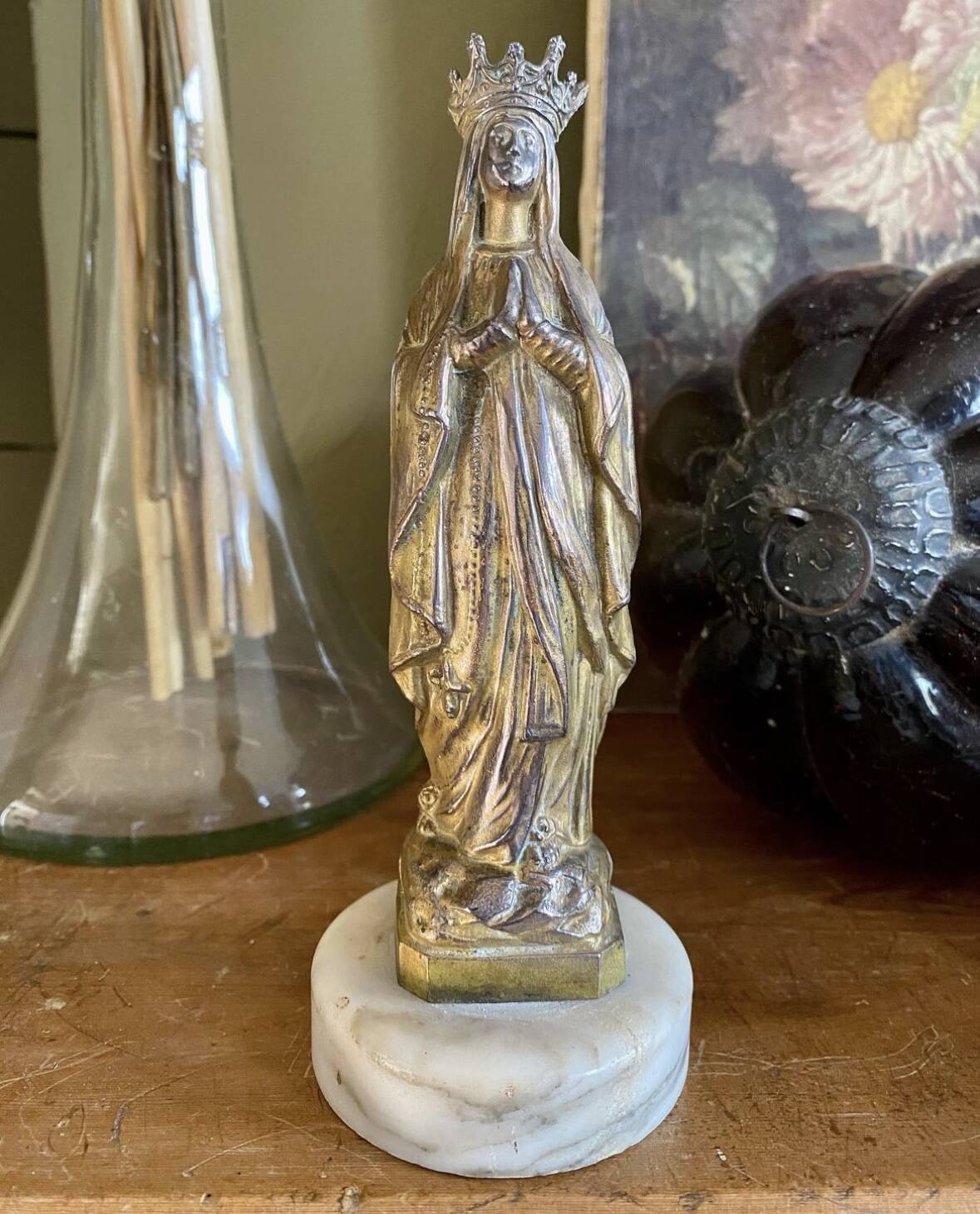Virgin Mary crowned in metal and brass