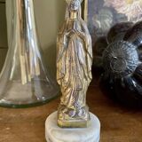 Virgin Mary crowned in metal and brass