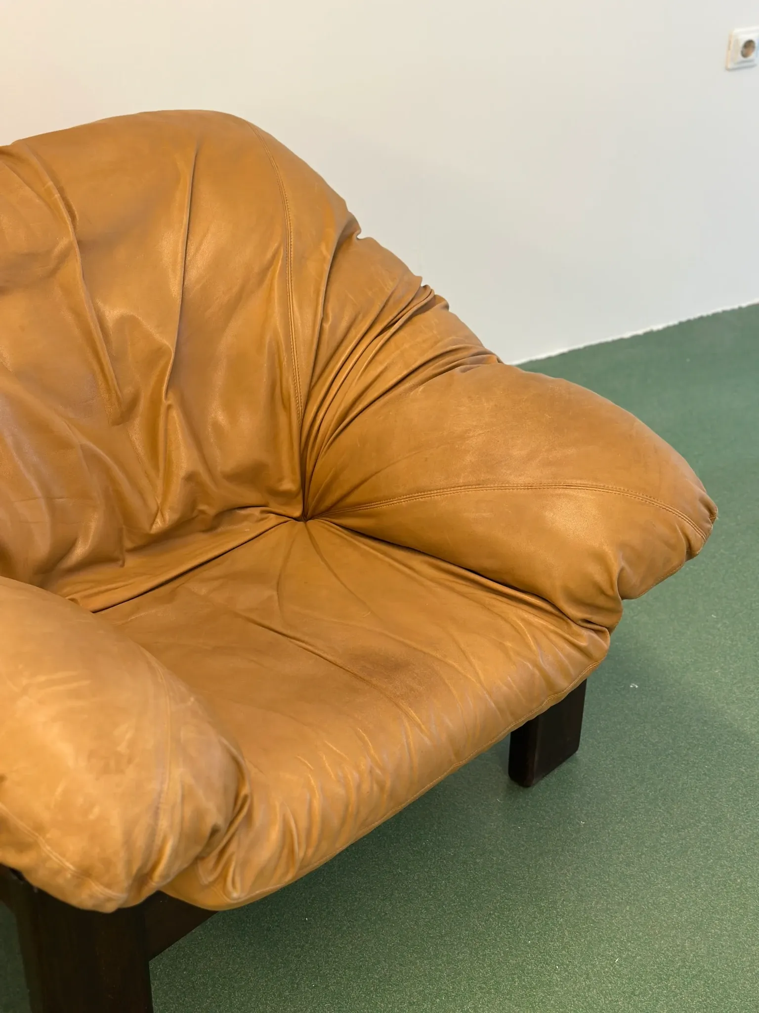 Pair of brutalist leather lounge chairs, 1960s