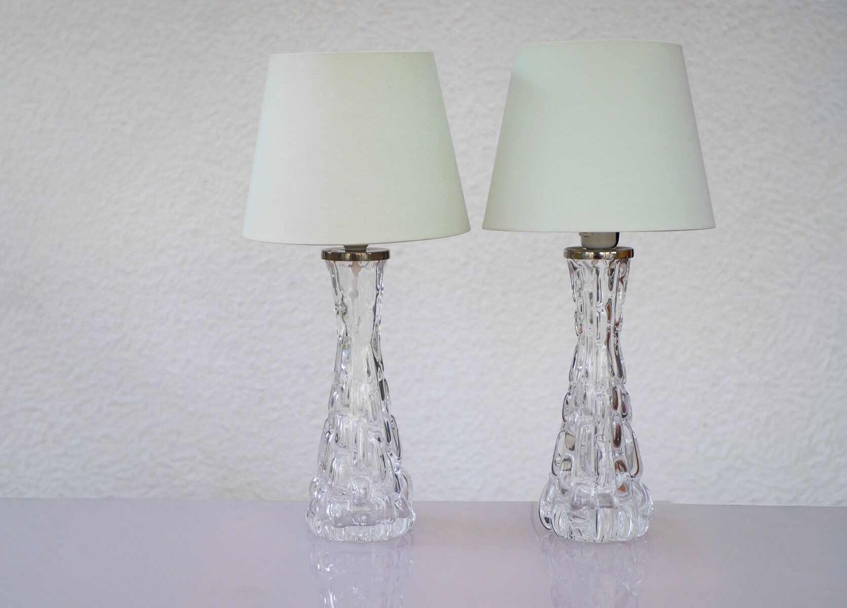 Crystal glass table lamps by Carl Fagerlund for Orrefors, Sweden.