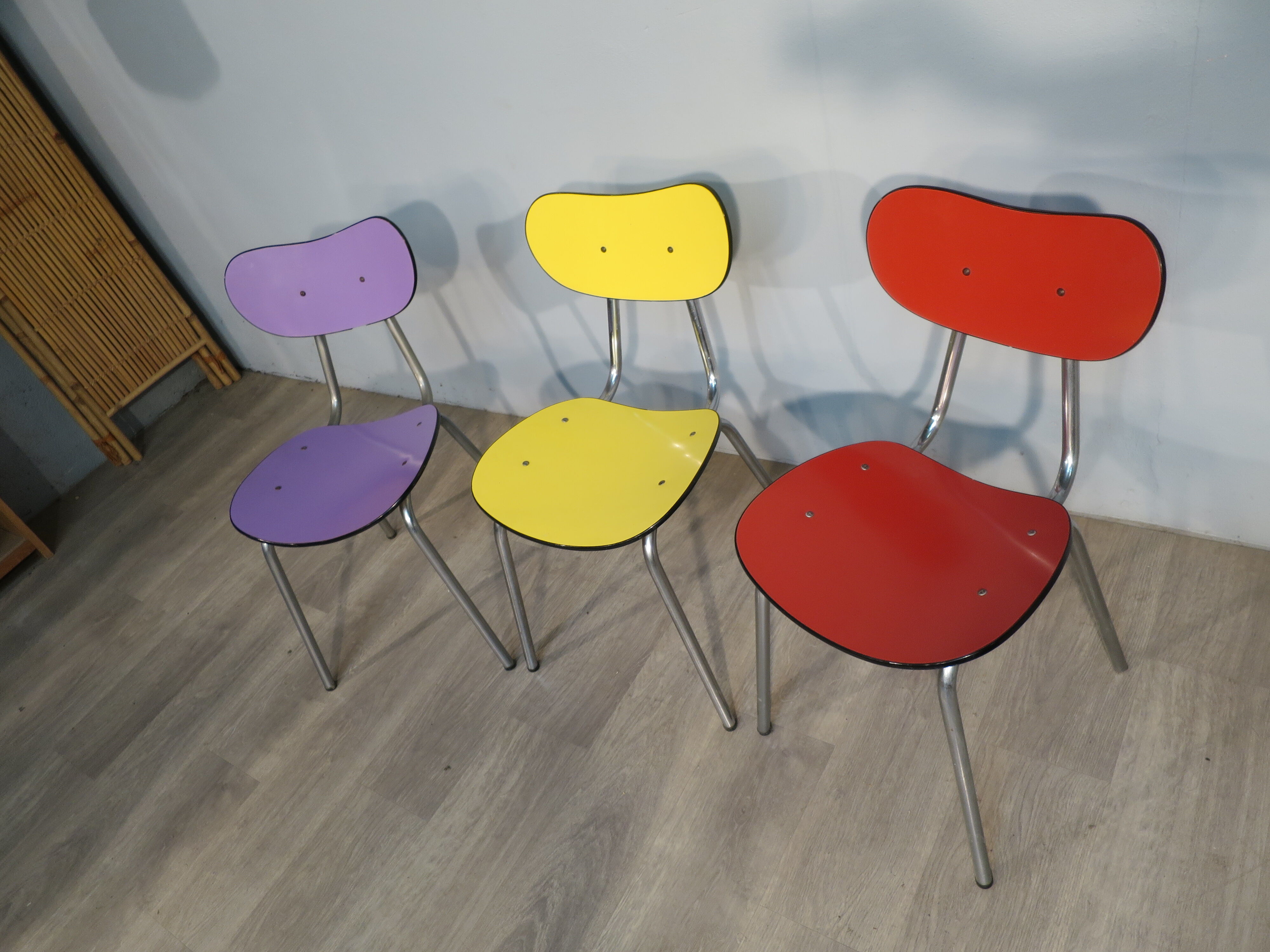 3 colored formica chairs