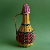 Glass bottle covered with multicolored scoubidou