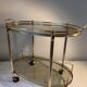 Neoclassical bar cart in gilded brass and smoked glass