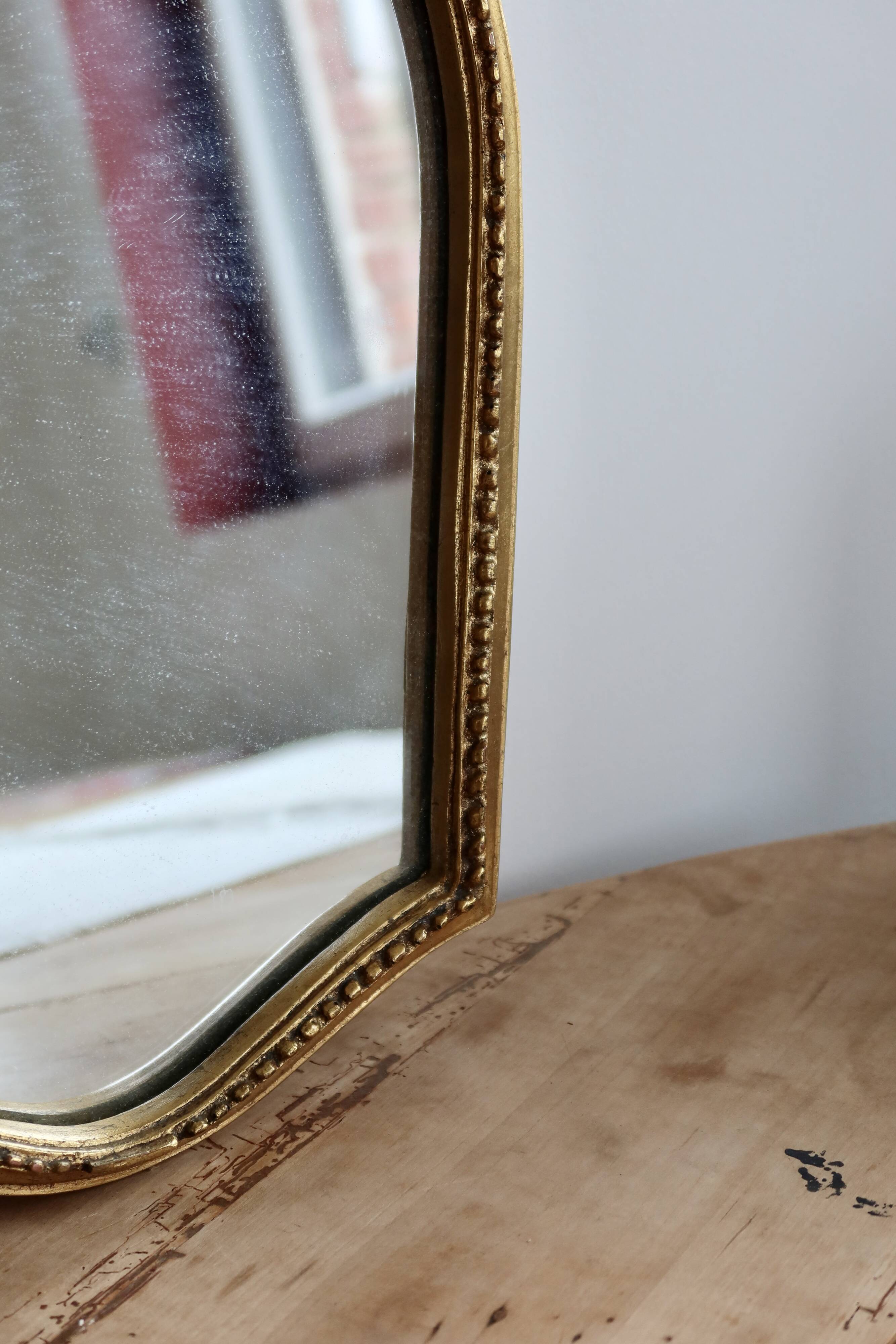 Antique gilded baroque mirror in wood – Distressed glass – Carved wood