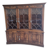 Elegant glass-fronted mahogany bookcase in English style.