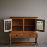 20th-century solid oak display cabinet with a glass front, by a Danish cabinetmaker.
