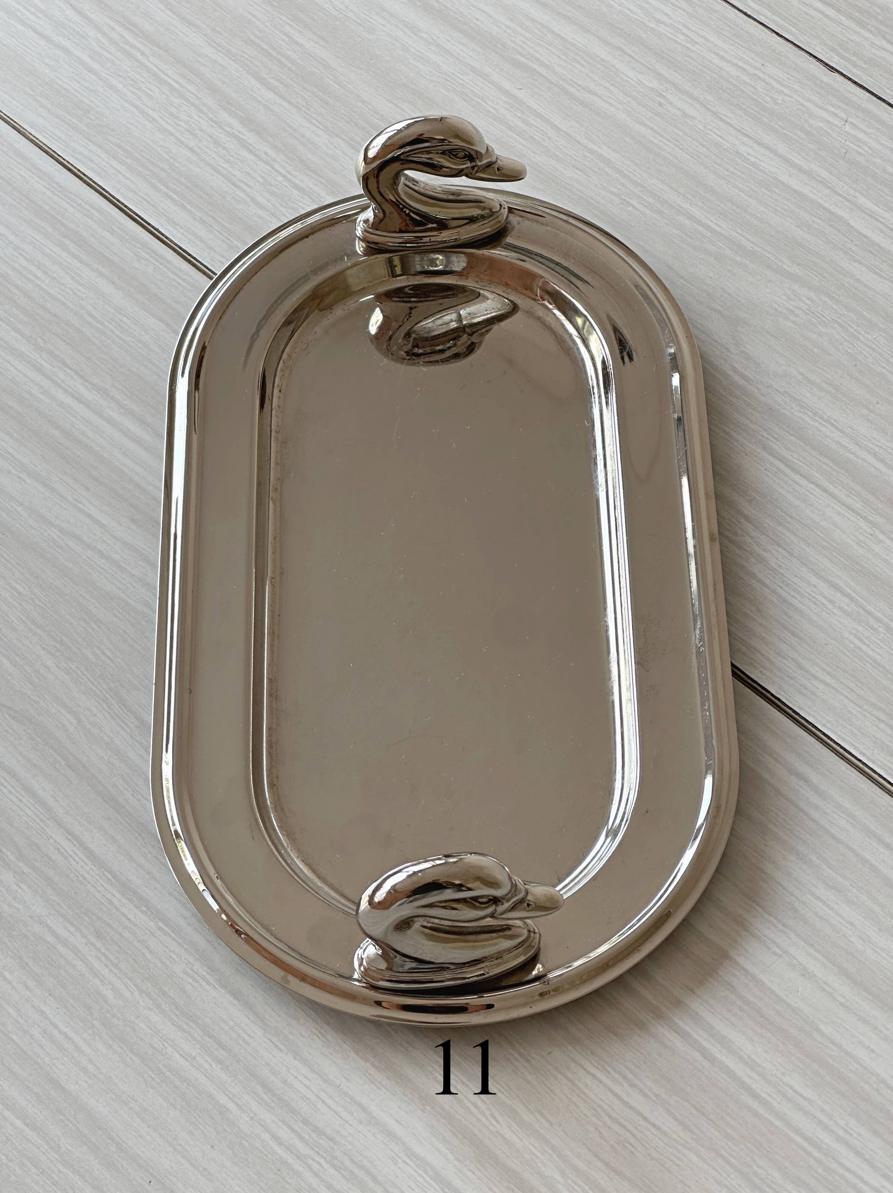 Metal dish with goose head handles serving tray