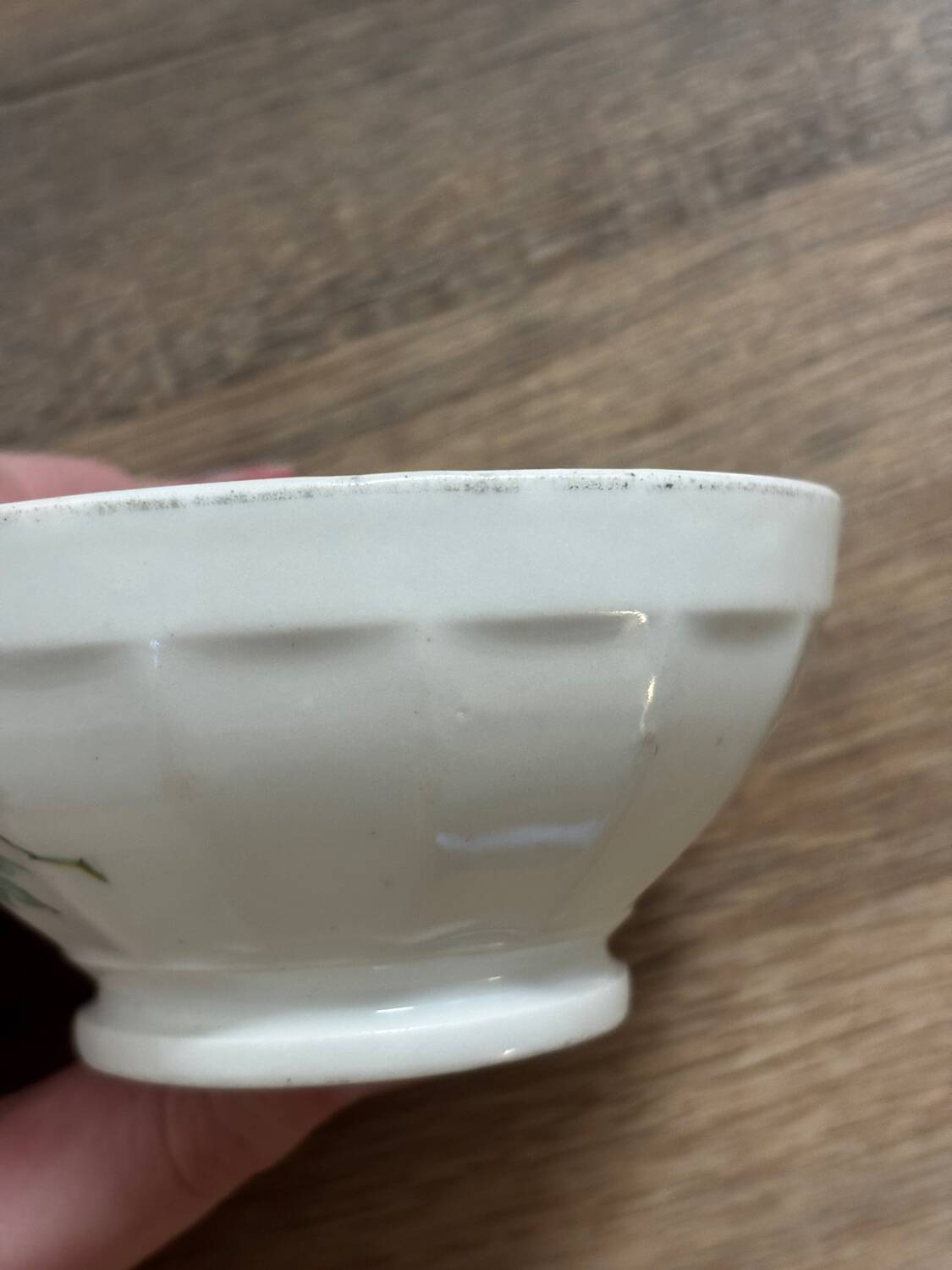 Vintage small antique bowl with floral decoration.