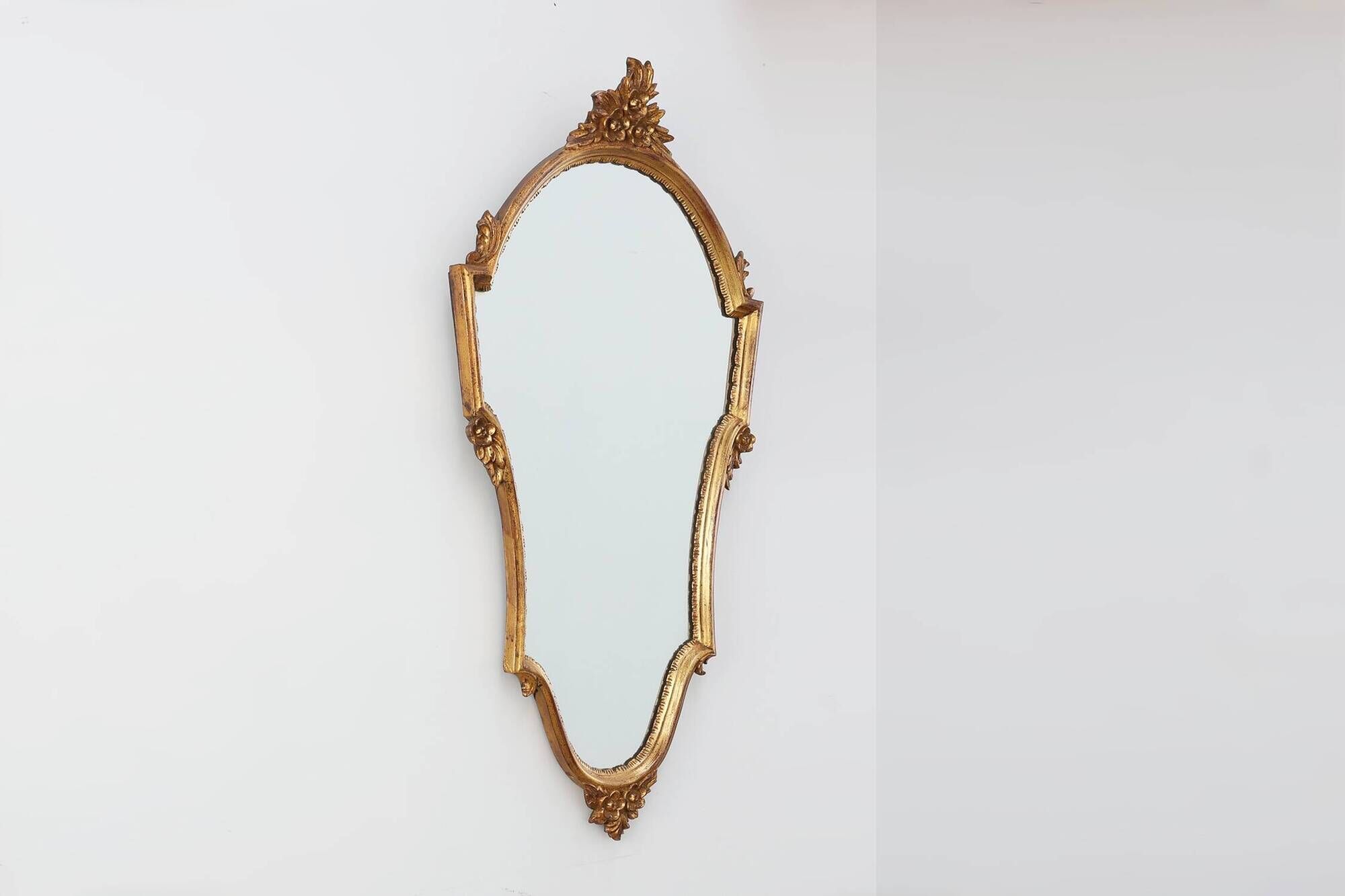20th Century Louis XVI style giltwood mirror with ornate crest, France