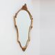 20th Century Louis XVI style giltwood mirror with ornate crest, France