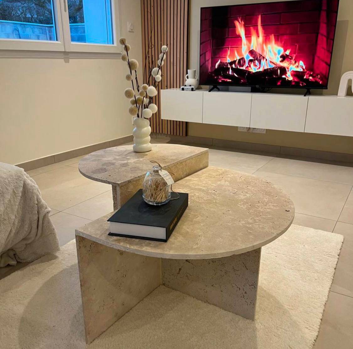 Half-moon travertine coffee table