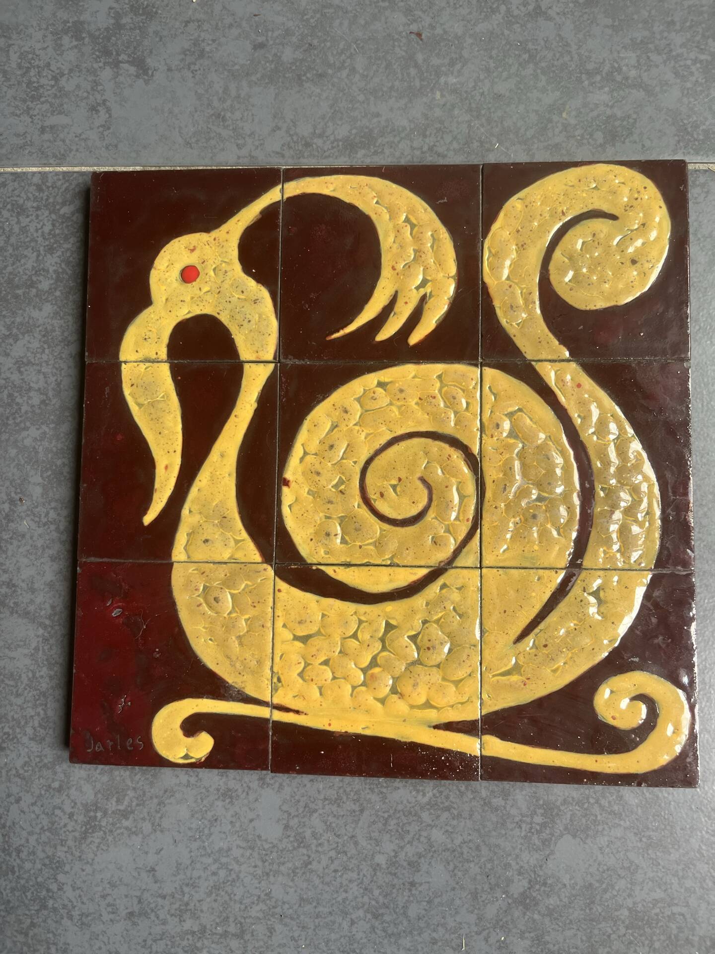 Ceramic plaque with zoomorphic pattern made up of 9 tiles.