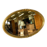 Vintage carved and gilded oval wall mirror
