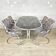 Vintage dining table in chrome and smoked glass by Gastone Rinaldi + chairs