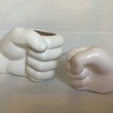 Duo of candle holder and empty pocket in the shape of a hand