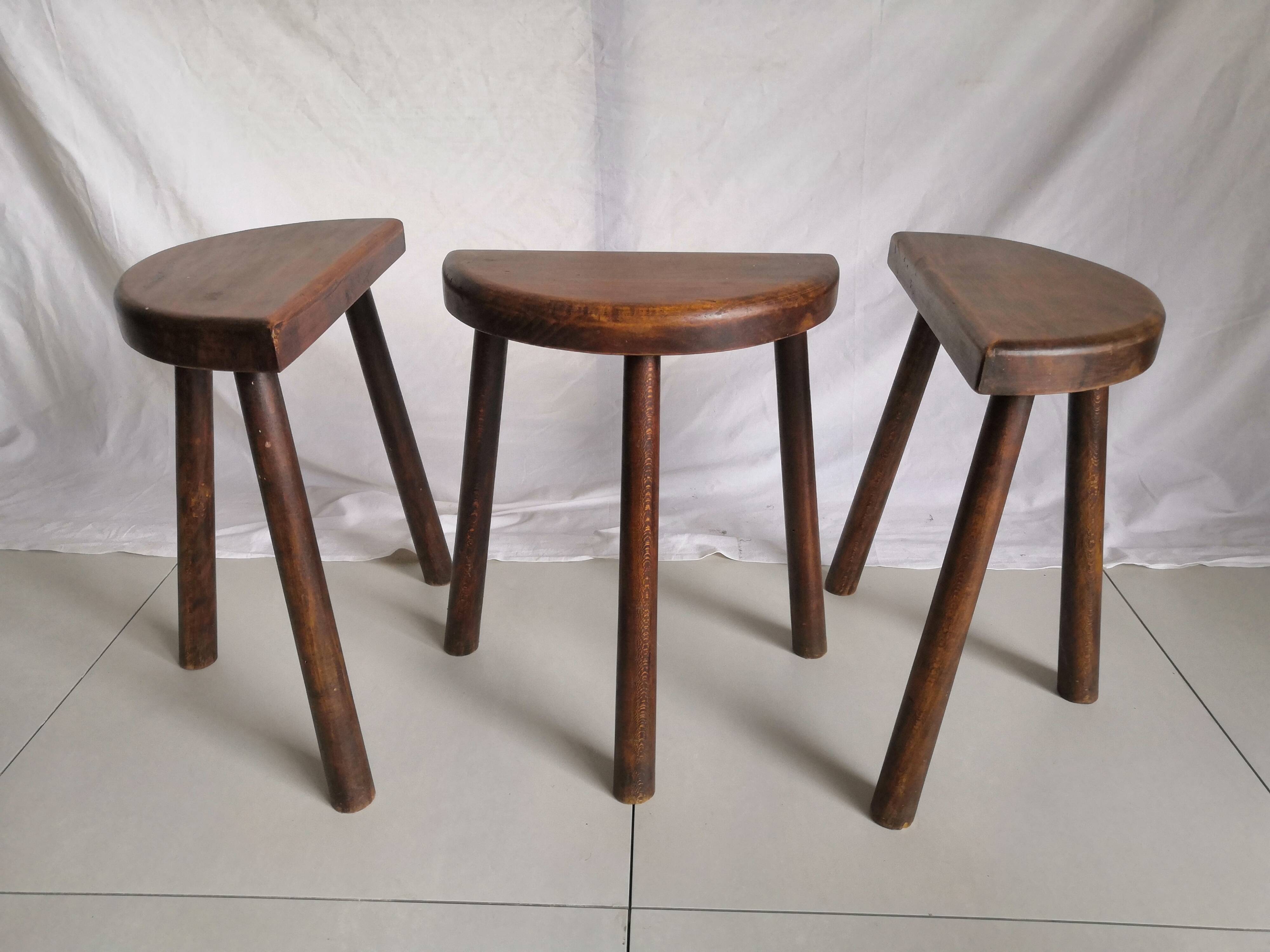 Trio of vintage brutalist tripod stools