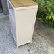 Beautiful art deco jam cupboard in delicate beige tone / and wicker basket
