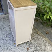Beautiful art deco jam cupboard in delicate beige tone / and wicker basket