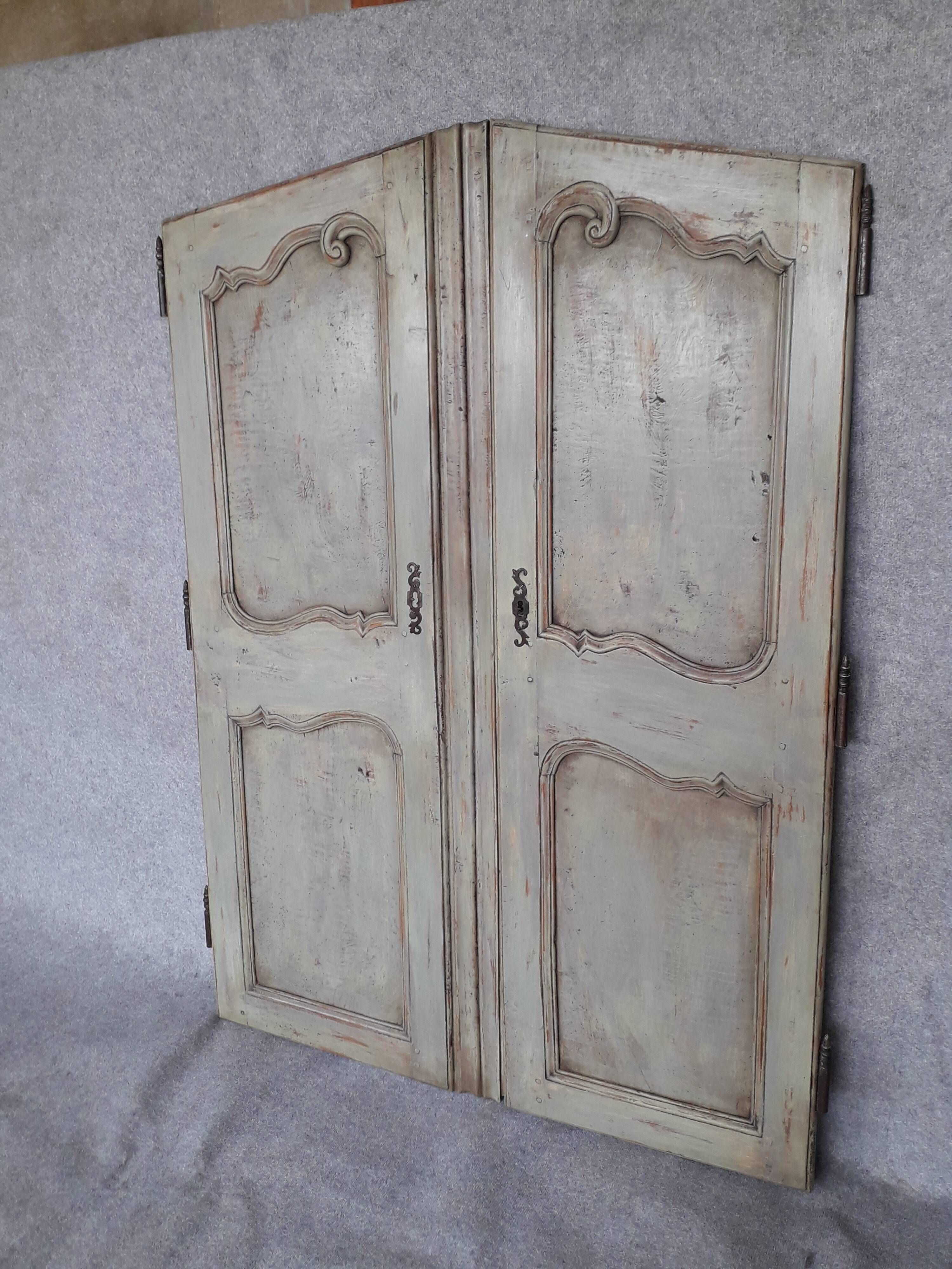 Pair of Louis XV period walnut and ash cabinet doors