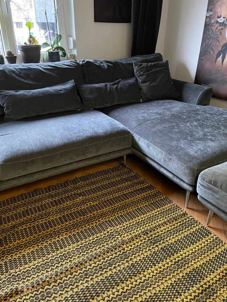 Romanian vintage carpet black design on a yellow background