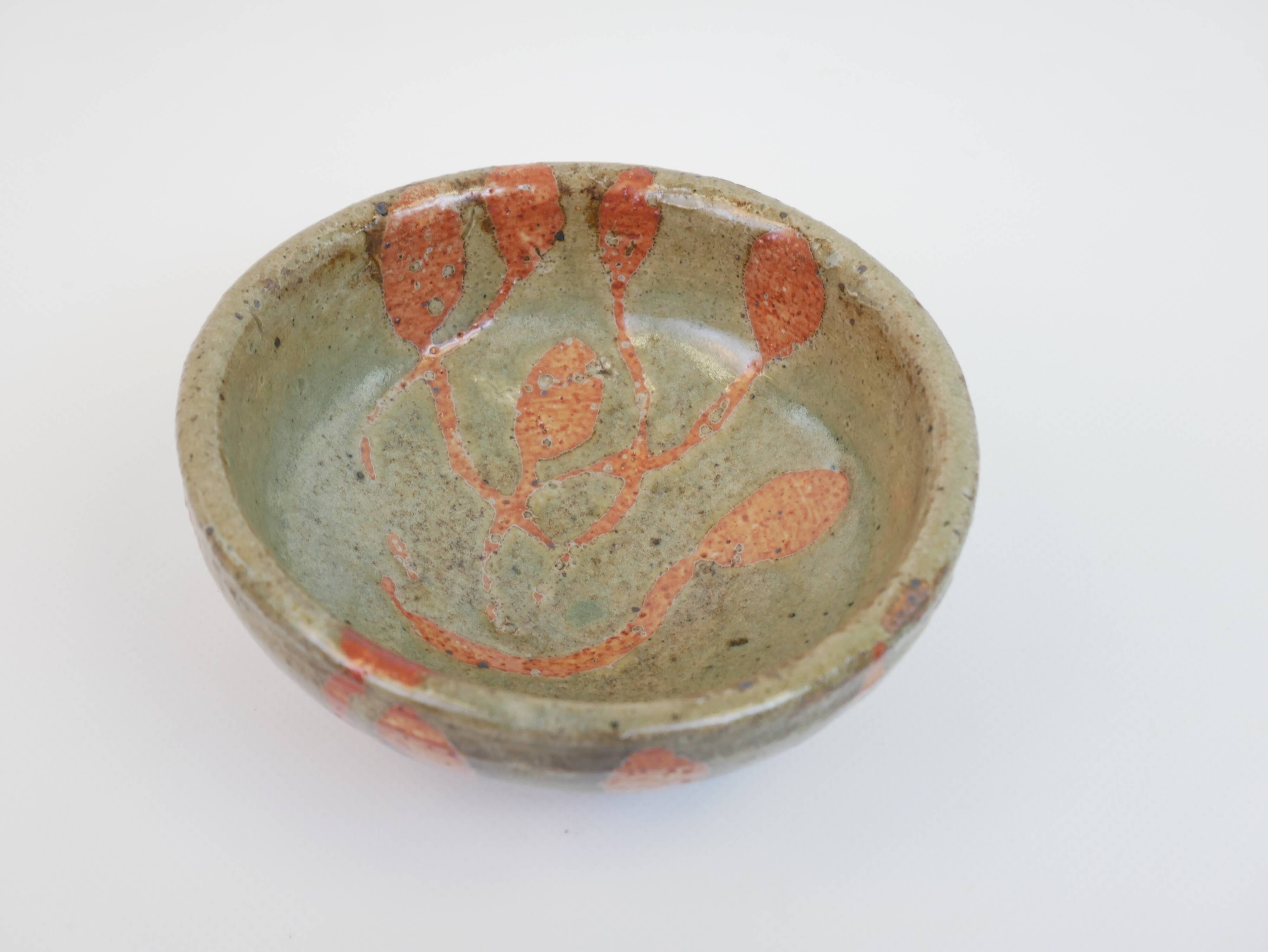 Small bowl in water green glazed ceramic with coral pink pattern