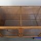 Large vintage wooden counter / display cabinet with 4 doors and glass